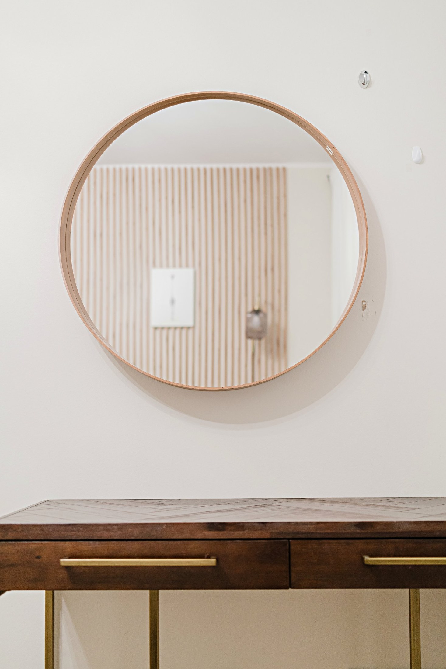 Hallway with round mirror